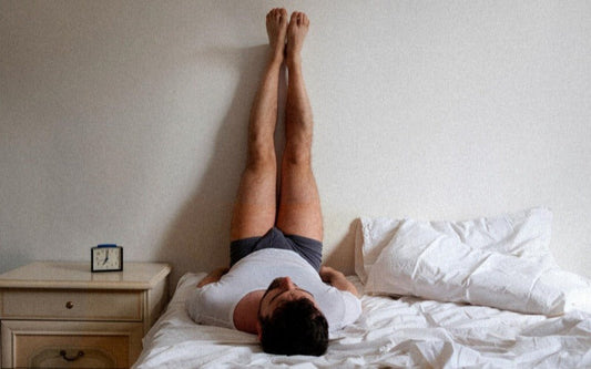 Person demonstrating a position related to how to self suck safely on a bed