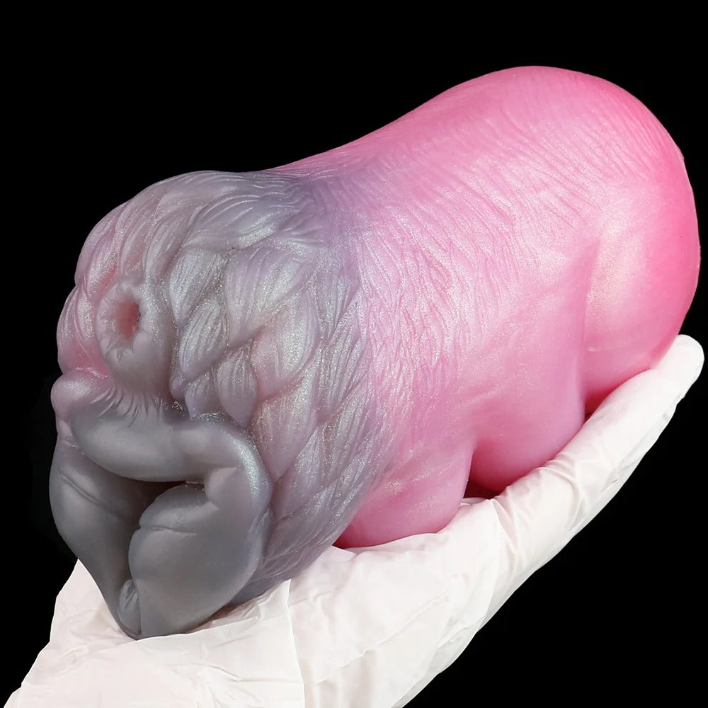 Wolf Beauty Pocket Pussy Male Masturbator - Fantasy Silicone in a hand showing detailed texture and colors